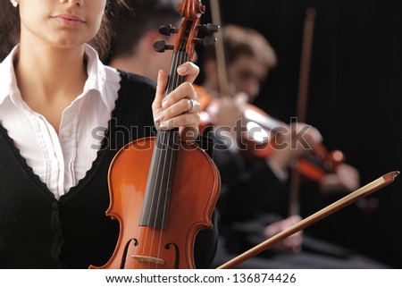 Violinist woman to a classical music concert