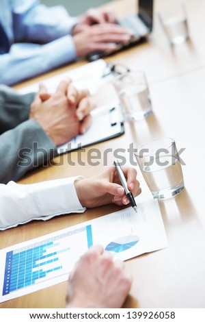 Close up of hands of business people during a meeting
