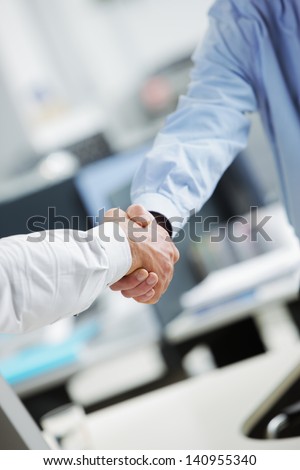 Business deal. Close up of a handshake