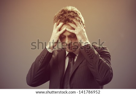Mature businessman stressed and worried look down
