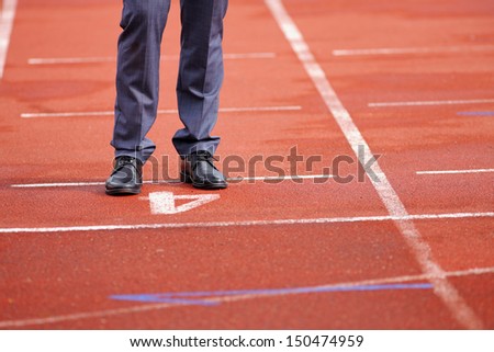 Businessman standing on the start line close up of shoes