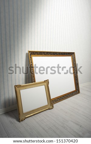 Two Baroque frames in a empty room