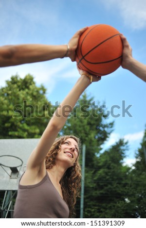 Friendship & sport. Three teenagers holding a basket ball
