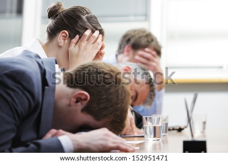 Business people sleeping in the conference room during a meeting