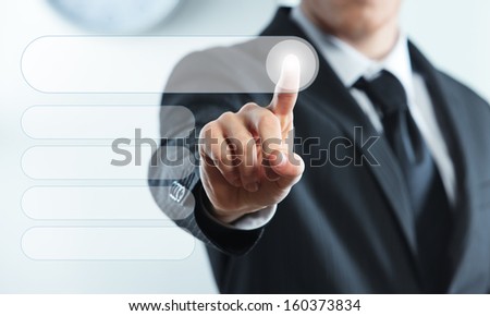 Businessman finger touches virtual buttons