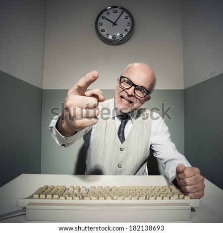 Vintage office worker pointing and yelling at computer.