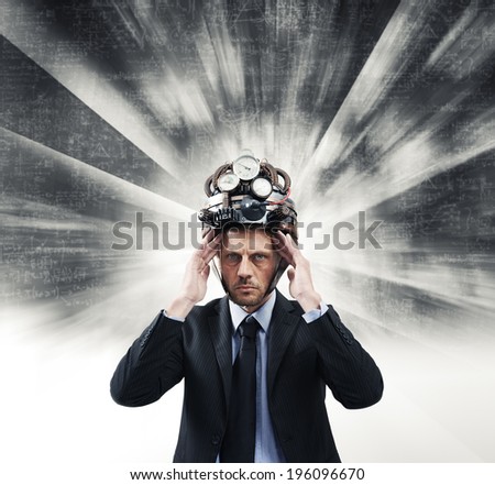Confident businessman thinking with head in hands wearing steampunk helmet