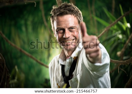 Successful winning businessman in torn clothing smiling with thumbs up
