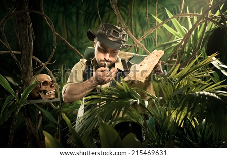 Lost explorer in the jungle holding an old map and smoking a cigarette.