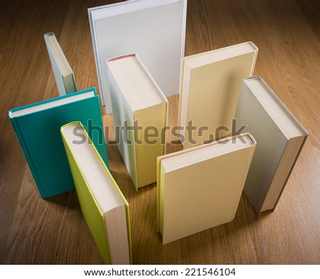 Standing books on floor composing a maze, learning and thinking concept.