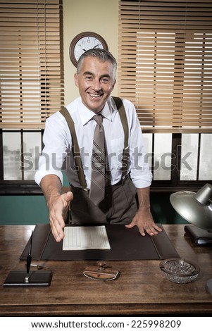 Cheerful businessman giving handshake and smiling, vintage office.