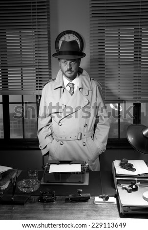 Attractive detective standing next to his desk, 1950s style office.