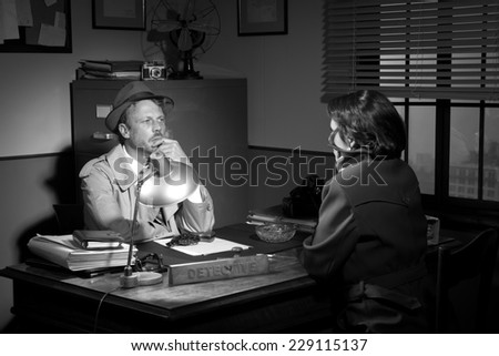 Handsome detective at office desk interviewing a young woman, 1950s film noir style.