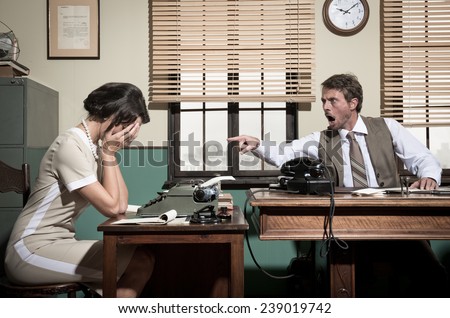Furious director arguing with young secretary, 1950s vintage office.