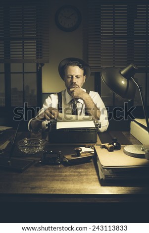 Confident journalist checking errors on text working at his desk, 1950s style office.