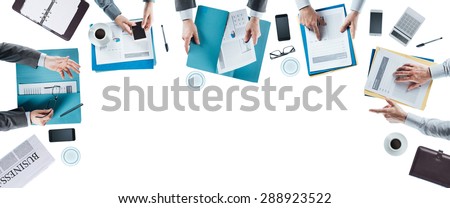 Business team meeting and working at office desk, hands top view, unrecognizable people, blank copy space