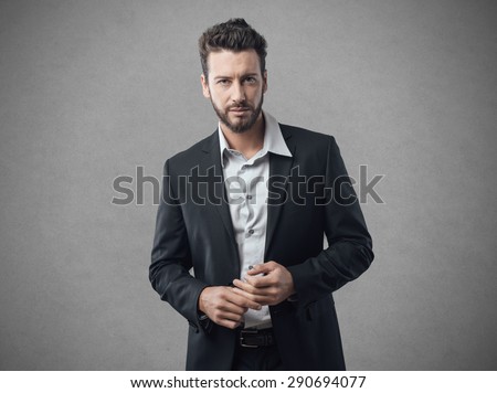 Confused businessman looking at camera with wrinkled shirt