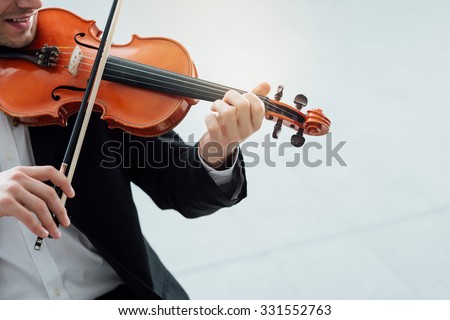 Talented violinist and classical music player solo performance, blank copy space on the right