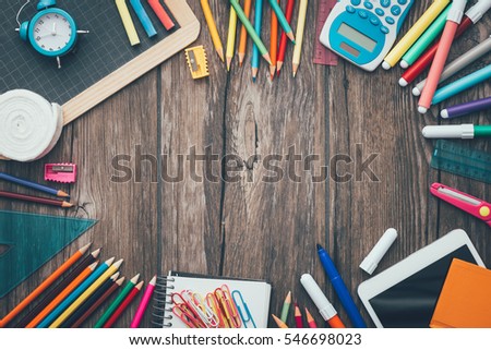 Back to school and education banner with colorful pencils and stationery, blank copy space at center