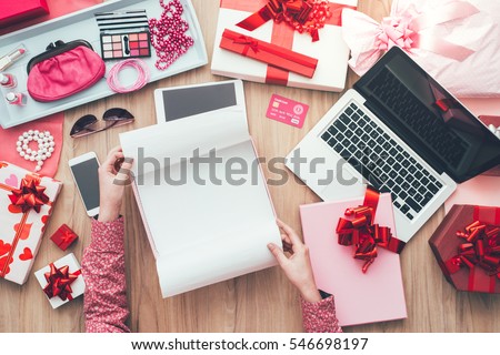 Female customer unboxing some beautiful gifts, online shopping, delivery and e-commerce concept