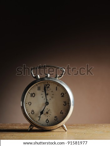 vintage alarm clock on table