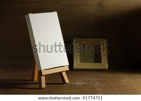 studio painter with easel and canvas, old wood