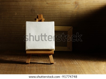 studio painter with easel and canvas, old wood