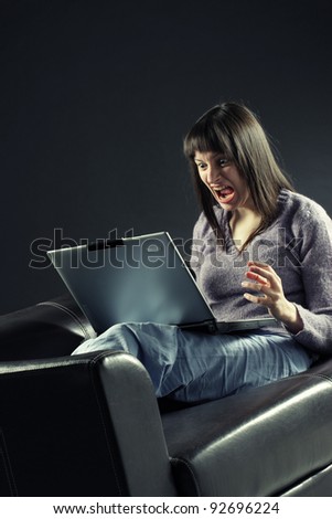computer problem, Young woman looking at the computer,  frustrated