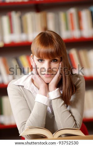 portrait of a female college student in a library
