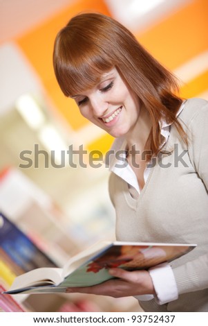 portrait of a smiling student in a library