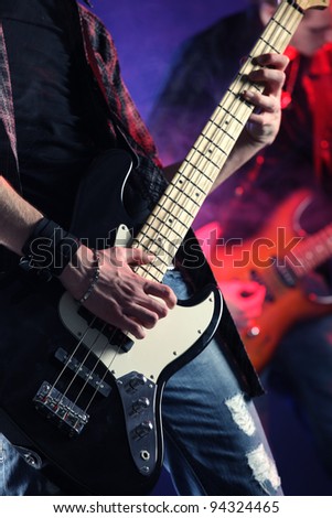 rock musicians playing at a live concert