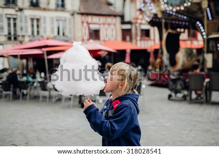 Little enjoying cotton candy, Dijon, France.