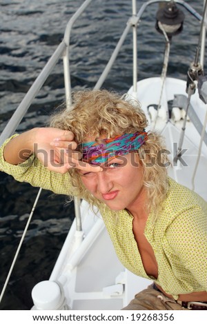 Beautiful pirate. Young beautiful blonde woman playing pirate during her Caribbean vacation on the boat.