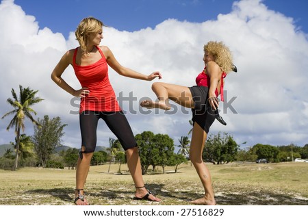 Two angry young women in quarrel.