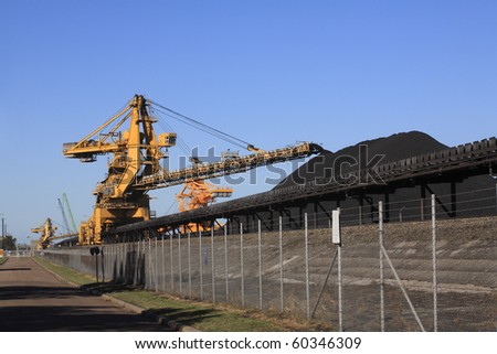 a huge coal loading conveyor belt piles coal. Kooragang Island, Newcastle, NSW, Australia