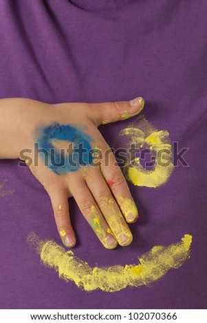 Painted face on purple shirt