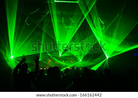 bright laser show in the crowd of merry men