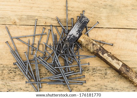 many gray nails on wooden boards