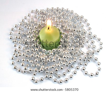 Small candle in silver decoration