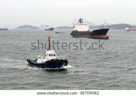 Tug boat - symbol and metaphor of power and pressing