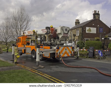 Wheelton, Chorley, Lancashire, UK. 24th April 2014.  Fire fighters and fire appliances outside the destroyed Dressers Arms in Wheelton follwing the fire that broke out earlier this morning.
