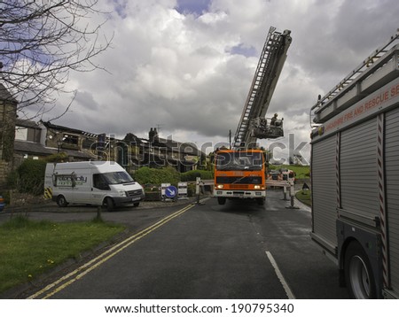 Wheelton, Chorley, Lancashire, UK. 24th April 2014.  Fire fighters and fire appliances outside the destroyed Dressers Arms in Wheelton follwing the fire that broke out earlier this morning.