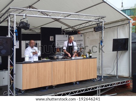 Chorley, Lancashire, UK. 11th May 2014.  Aazam Ahmed, BBC fusion chef cooking live at the Chorley food festival.