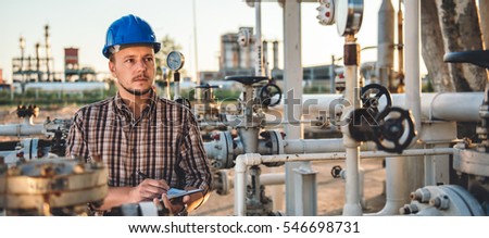 Man checking manometer in natural gas factory