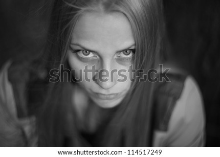 frightened young woman in black and white colors