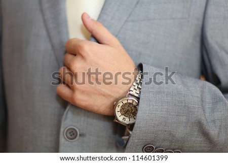 Mister in a suit, watch, time, business, finance, money