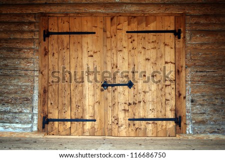 large wooden door in an old country house