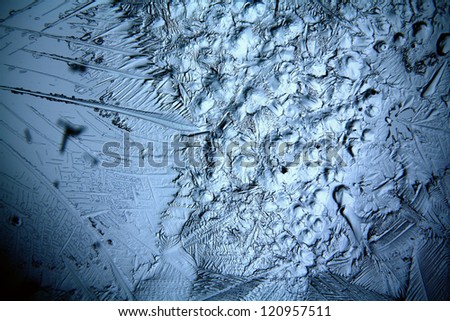 Christmas ice background, macro texture ice cold abstract background in shades of blue