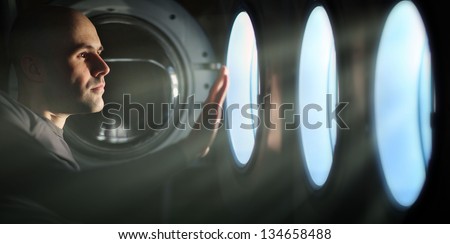Man Looking inside the washing machine