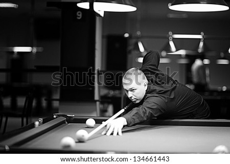 men snooker game at table, having beer, focus on snooker balls.